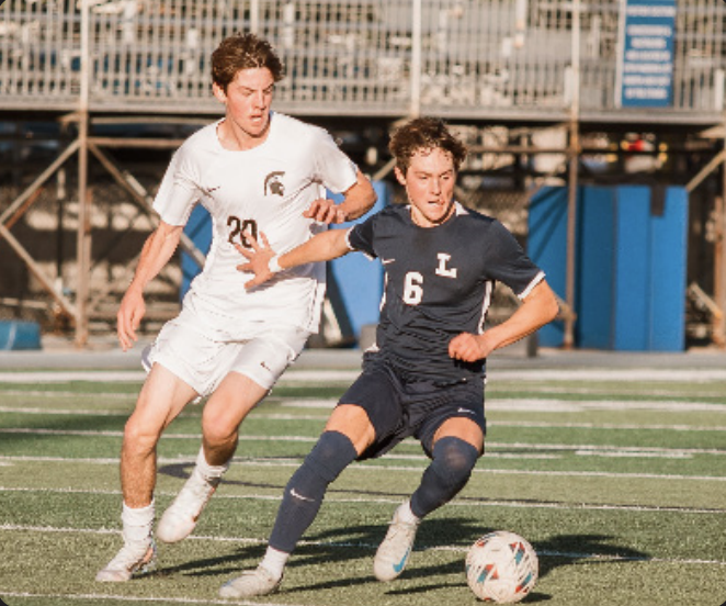 WILL HOSHEK '25 takes control of the ball against South Torrance